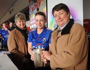 21 February 2010; Lynn Kelly, President of 3rd Level Camogie Association, presents WIT captain Ursula Jacob with the Ashbourne Cup in the compnay of Joan O'Flynn, President of the Camogie Association. Ashbourne Cup Final Waterford Institute of Technology v University College Cork. Cork Institute of Technology, Cork. Picture credit: Stephen McCarthy / SPORTSFILE