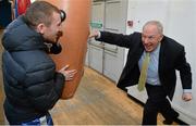 9 March 2016; Michael Ring, T.D., Minister of State for Tourism & Sport, hits a punching bag held by Irish boxer Paddy Barnes at the IABA High Performance Squad before a training session to mark 150 days to go to the Rio 2016 Olympic Games. National Boxing Stadium, Dublin. Picture credit: Cody Glenn / SPORTSFILE