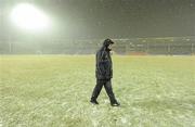 20 February 2010; Kilkenny manager Brian Cody inspects the pitch amid falling snow which forced the cancellation of the game. Allianz GAA Hurling National League, Division 1 Round 1, Tipperary v Kilkenny, Semple Stadium, Thurles, Co. Tipperary. Picture credit: Brendan Moran / SPORTSFILE