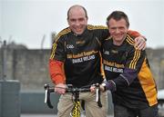 23 February 2010; The All-Ireland winning Kilkenny hurling squad, along with past players, and Ireland's top handballers, are preparing to don a jersey of a different nature on Saturday the 6th of March - taking to the roads of Kilkenny for a thirteen stage cycle around Kilkenny City to raise money for Enable Ireland. The Cats pedalling line up includes current stars such as Henry Shefflin and Tommy Walsh, as well as former giants of the game DJ Carey, Joe Hennessy and Noel Skehan. The event has been organised by Kilkenny handball legend Michael 'Ducksy' Walsh, who amassed and incredible 38 All-Ireland senior titles. Still playing at the top levels of the sport, Ducksy now dedicates much of his time to charity fundraising. The event is also being supported by the GAA and by the Irish Handball Council. At the announcement of the final route for the cycle are Kilkenny hurling great DJ Carey, left, and Kilkenny handball legend Michael 'Ducksy' Walsh, right. Enable Ireland, O'Neill Centre, St. Joseph's Road, Kilkenny. Picture credit: Brian Lawless / SPORTSFILE