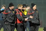 13 February 2010; The Down management team, from left to right, Jerome Johnston, selector, James McCartan, manager, Paddy Tally, trainer, and Brian McIver, selector, leave the field at half time. Allianz National Football League, Division 2, Round 2, Down v Meath, Pairc Esler, Newry, Co. Down. Picture credit: Oliver McVeigh / SPORTSFILE