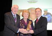 24 February 2010; Alda O'Gorman, on behalf of her brother Joe O'Flynn, receives the Community Administrator of the Year award from Irish Olympian Dr. Ronnie Delany, left, and Martin Cullen, TD, Minister for Arts, Sport and Tourism, at the Volunteers in Irish Sports Awards 2009. Farmleigh, Castleknock, Dublin. Picture credit: Brendan Moran / SPORTSFILE