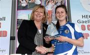 12 March 2016; St Patrick's College's Emma Troy is presented with the Player of the Match by Marie Hickey, President, Ladies Gaelic Football Association, after the game. Giles Cup Final 2016, St Patrick's College, Drumcondra, v Mary Immaculate College, Limerick. John Mitchels GAA Club, Tralee, Co. Kerry. Picture credit: Brendan Moran / SPORTSFILE