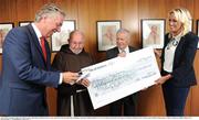 2 June 2016; From left to right, FAI Chief Executive John Delaney, Brother Kevin Crowley, John Giles, from the John Giles Foundation, and Emma English, Dublin Free Event Coordinator, during the FAI cheque presentation to Brother Kevin's Charity at the FAI HQ, National Sports Campus, Abbotstown, Dublin. Photo by Seb Daly/Sportsfile