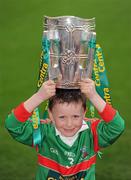26 February 2010; Seven year old GAA Star of the future Sean Byrne, from the Naomh Barróg GAA Club, Kilbarrack, Dublin, with the Liam MacCarthy Cup at the announcement of a new partnership with Centra and its 558 retail partners. Centra have been confirmed as an official sponsor of the GAA Hurling All-Ireland Championship. Croke Park, Dublin. Picture credit: Ray McManus / SPORTSFILE