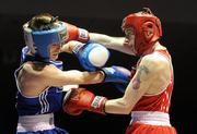 20 February 2010; Ruairi Dalton, Holy Trinity, red, exchanges punches with Gary Molly, Moate, during their 51kg bout. National Boxing Championships - Semi-Finals, National Stadium, Dublin. Picture credit: Stephen McCarthy / SPORTSFILE