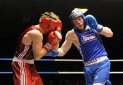 20 February 2010; Ray Moylette, St Annes, blue, exchanges punches with Philip Sutcliffe, Crumlin, red, during their 64kg bout. National Boxing Championships - Semi-Finals, National Stadium, Dublin. Picture credit: Stephen McCarthy / SPORTSFILE