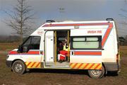 21 February 2010; A member of the Irish Red Cross sits in an ambulance as she watches the game. Purcell Shield Final. Queen's University, Belfast, v National University of Ireland, Maynooth, pitch 3, Cork Institute of Technology, Cork. Picture credit: Ray McManus / SPORTSFILE