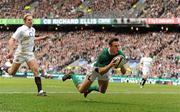 27 February 2010; Ireland's Tommy Bowe on his way to scoring his side's first try, and his twelfth of all time, against England. RBS Six Nations Rugby Championship, England v Ireland, Twickenham Stadium, Twickenham, London, England. Picture credit: Brendan Moran / SPORTSFILE