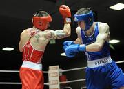 27 February 2010; David Oliver Joyce, St Michaels Athy, red, exchanges punches with Ross Hickey, Grangcon, blue, during their 60kg bout. National Mens Elite Championships Semi-Finals - Saturday, National Stadium, Dublin. Picture credit: Stephen McCarthy / SPORTSFILE