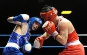 27 February 2010; David Oliver Joyce, St Michaels Athy, red, exchanges punches with Ross Hickey, Grangcon, blue, during their 60kg bout. National Mens Elite Championships Semi-Finals - Saturday, National Stadium, Dublin. Picture credit: Stephen McCarthy / SPORTSFILE