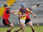 28 February 2010; Diarmuid Lyng, Wexford, is tackled by Ciaran Coulter and Liam Clarke, Down. Allianz GAA Hurling National League Division 2 Round 2, Wexford v Down, Wexford Park, Wexford. Picture credit: Matt Browne / SPORTSFILE