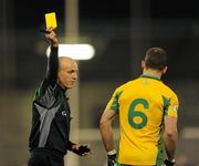 27 February 2010; Damien Burke, Corofin, is shown a yellow card by referee Cormac Reilly. AIB GAA Football All-Ireland Senior Club Championship Semi-Final Refixture, Corofin v St. Gall's, Parnell Park, Dublin. Picture credit: Ray McManus / SPORTSFILE