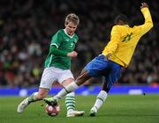 2 March 2010; Kevin Doyle, Republic of Ireland, in action against Robinho, Brazil. International Friendly, Republic of Ireland v Brazil, Emirates Stadium, London, England. Picture credit: Stephen McCarthy / SPORTSFILE