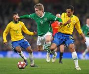 2 March 2010; Kevin Doyle, Republic of Ireland, in action against Gilberto Silva, Brazil. International Friendly, Republic of Ireland v Brazil, Emirates Stadium, London, England. Picture credit: David Maher / SPORTSFILE