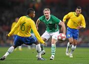 2 March 2010; Liam Lawrence, Republic of Ireland, in action against Michel Bastos, Brazil. International Friendly, Republic of Ireland v Brazil, Emirates Stadium, London, England. Picture credit: David Maher / SPORTSFILE