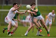 13 March 2016; Donal Lenihan, Meath, is tackled by Mattie Donnelly, left, and Johnathan Monroe, Tyrone. Allianz Football League, Division 2, Round 5, Meath v Tyrone. Páirc Táilteann, Navan, Co. Meath. Picture credit: Ramsey Cardy / SPORTSFILE