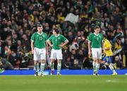 2 March 2010; Dejected Republic of Ireland players, from left to right, Darron Gibson, Sean St.Ledger and Keith Andrews, after Brazil's Robinho scored his side's second goal. International Friendly, Republic of Ireland v Brazil, Emirates Stadium, London, England. Picture credit: David Maher / SPORTSFILE