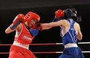 5 March 2010; Jennifer Harte, Four Corners, left, exchanges punches with Catherine O'Grady, Clann Naofa, during their 48kg women's novice bout. National Men's & Women's Elite National Championships 2010 Finals - Friday, National Stadium, Dublin. Picture credit: Stephen McCarthy / SPORTSFILE