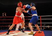 5 March 2010; Kelly Harrington, West Finglas, right, and Jessica Lyons, St Francis, Limerick, exchange punches during their elite women's 69kg final bout. National Men's & Women's Elite National Championships 2010 Finals - Friday, National Stadium, Dublin. Picture credit: Stephen McCarthy / SPORTSFILE
