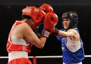 5 March 2010; Jennifer Harte, Four Corners, left, exchanges punches with Catherine O'Grady, Clann Naofa, during their 48kg women's novice final bout. National Men's & Women's Elite National Championships 2010 Finals - Friday, National Stadium, Dublin. Picture credit: Stephen McCarthy / SPORTSFILE