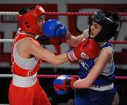 5 March 2010; Jennifer Harte, Four Corners, left, exchanges punches with Catherine O'Grady, Clann Naofa, during their 48kg women's novice final bout. National Men's & Women's Elite National Championships 2010 Finals - Friday, National Stadium, Dublin. Picture credit: Stephen McMahon / SPORTSFILE