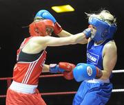 6 March 2010; Sharon McGing, St Annes Westport, left, exchanges punches with Amanda Loughlin, Bray, during their women's novice 54kg bout. Men's Elite & Women's Novice National Championships 2010 Finals - Saturday Evening Session, National Stadium, Dublin. Picture credit: Stephen McCarthy / SPORTSFILE