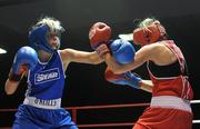 6 March 2010; Sharon McGing, St Annes Westport, right, exchanges punches with Amanda Loughlin, Bray, during their women's novice 54kg bout. Men's Elite & Women's Novice National Championships 2010 Finals - Saturday Evening Session, National Stadium, Dublin. Picture credit: Stephen McCarthy / SPORTSFILE