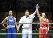 6 March 2010; Sabrina Hughes, Ryston, is announced victorious over Mairead Keane, Ballinacarrow, by referee Paul McMahon following their women's novice 60kg. Men's Elite & Women's Novice National Championships 2010 Finals - Saturday Evening Session, National Stadium, Dublin. Picture credit: Stephen McCarthy / SPORTSFILE