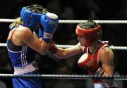 6 March 2010; Katie Taylor, Bray, Ireland, right, exchanges punches with Julia Tsyplakova, Ukraine, during their women's 60kg special bout. Men's Elite & Women's Novice National Championships 2010 Finals - Saturday Evening Session, National Stadium, Dublin. Picture credit: Stephen McCarthy / SPORTSFILE