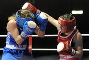 6 March 2010; Katie Taylor, Bray, Ireland, right, exchanges punches with Julia Tsyplakova, Ukraine, during their women's 60kg special bout. Men's Elite & Women's Novice National Championships 2010 Finals - Saturday Evening Session, National Stadium, Dublin. Picture credit: Stephen McCarthy / SPORTSFILE