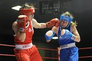 6 March 2010; Katie Taylor, Bray, Ireland, left, exchanges punches with Julia Tsyplakova, Ukraine, during their women's 60kg special bout. Men's Elite & Women's Novice National Championships 2010 Finals - Saturday Evening Session, National Stadium, Dublin. Picture credit: Stephen McCarthy / SPORTSFILE