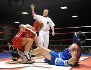 6 March 2010; John Joe Nevin, Cavan, left, and Derek Thorpe, St Aidans, fall to the canvas during their men's elite 54kg final bout. Men's Elite & Women's Novice National Championships 2010 Finals - Saturday Evening Session, National Stadium, Dublin. Picture credit: Stephen McCarthy / SPORTSFILE