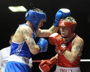 6 March 2010; Eric Donovan, St Michaels Athy, right, exchanges punches with David Oliver Joyce, St Michaels Athy, during their men's elite 60kg final bout. Men's Elite & Women's Novice National Championships 2010 Finals - Saturday Evening Session, National Stadium, Dublin. Picture credit: Stephen McCarthy / SPORTSFILE