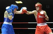 6 March 2010; Eric Donovan, St Michaels Athy, exchanges punches with David Oliver Joyce, St Michaels Athy, during their men's elite 60kg final bout. Men's Elite & Women's Novice National Championships 2010 Finals - Saturday Evening Session, National Stadium, Dublin. Picture credit: Stephen McCarthy / SPORTSFILE