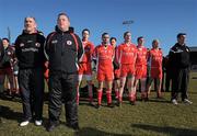 7 March 2010; Tyrone manager Mickey Harte, left, and trainer Fergal McCann, stand with the Tyrone team for the National Anthem. Allianz GAA Football National League, Division 1, Round 3, Monaghan v Tyrone, Inniskeen GAA Grounds, Inniskeen, Co. Monaghan. Picture credit: Brian Lawless / SPORTSFILE