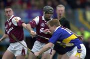 28 April 2001; Declan Ryan of Tipperary is tackled by Derek Hardiman, left, and Michael Healy of Galway during the Allianz GAA National Hurling League Division 1 Semi-Final match between Galway and Tipperary at Cusack Park in Ennis, Clare. Photo by Brendan Moran/Sportsfile