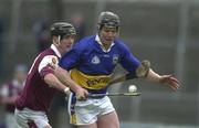 28 April 2001; Conor Gleeson of Tipperary races clear of Ollie Fahy of Galway during the Allianz GAA National Hurling League Division 1 Semi-Final match between Galway and Tipperary at Cusack Park in Ennis, Clare. Photo by Brendan Moran/Sportsfile