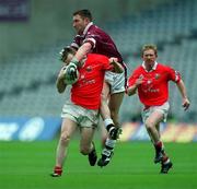 29 April 2001; Michael O'Donovan of Cork is tackled by David Mitchell of Westmeath during the Allianz GAA National Football League Division 2 Final match between Westmeath and Cork at Croke Park in Dublin. Photo by Ray Lohan/Sportsfile