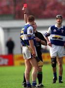 29 April 2001; Niall Rigney of Laois is sent off by referee Gerry Devlin during the Guinness Leinster Senior Hurling Championship Preliminary Round match between Carlow and Laois at Dr Cullen Park in Carlow. Photo by Damien Eagers/Sportsfile
