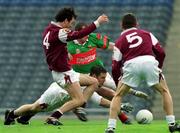 29 April 2001; Galway goalkeeper Padraig Lally supported by Michael Colleran and Declan Meehan, 5, combine to stop Marty McNicholas of Mayo's attack during the Allianz GAA National Football League Division 1 Final match betweem Mayo and Galway at Croke Park in Dublin. Photo by Ray McManus/Sportsfile