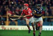 4 April 1999; Seánie McGrath of Cork in action against Thomas Dunne of Tipperary during the Church & General National Hurling League Division 1B match between Tipperary and Cork at Semple Stadium in Thurles, Tipperary. Photo by Brendan Moran/Sportsfile