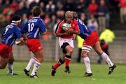 21 April 2001; Mike Mullins of Munster is tacked by Franck Comba and Pieter De Villiers of Stade Francais during the Heineken European Cup Semi-Final match between Stade Francais and Munster at Stadium Lille Metropole in Lille, France. Photo by Brendan Moran/Sportsfile