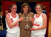 2 May 2001; Presentation Thurles co-captains Grainne Dwyer, left, and Mags Bourke are presented with the cup by Helen King, Cadbury's Ireland, after the Cadbury's Time Out All-Ireland Senior &quot;A&quot; Schools Final match between Presentation Thurles and Scoil Ruain Killenaule National Basketball Arena in Tallaght, Dublin. Photo by Brendan Moran/Sportsfile