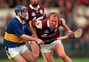 28 April 2001; Finbar Gantley of Galway is tackled by Eddie Enright of Tipperary during the Allianz GAA National Hurling League Division 1 Semi-Final match between Galway and Tipperary at Cusack Park in Ennis, Clare. Photo by Ray McManus/Sportsfile