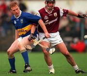 28 April 2001; Declan Ryan of Tipperary in action against Cathal Moore of Galway during the Allianz GAA National Hurling League Division 1 Semi-Final match between Galway and Tipperary at Cusack Park in Ennis, Clare. Photo by Ray McManus/Sportsfile