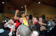 4 May 2001; Isaac Westbrooks of St Fintan's celebrates with fans after scoring the winning basket on the buzzer in the Cadbury's Time Out All Ireland Under 19 'A' Schoolboys Final match between De La Salle College, Waterford and St Fintan's High School, Sutton, at the National Basketball Arena in Tallaght, Dublin. Photo by Brendan Moran/Sportsfile