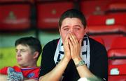 6 May 2001; A dejected Shelbourne fan sits in the stand after the Eircom League Premier Division match between Shelbourne and Cork City at Tolka Park in Dublin. Photo by David Maher/Sportsfile