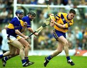 6 May 2001; John Reddan of Clare in action against Eoin Kelly, left, and Eddie Enright of Tipperary during the Allianz National Hurling League Final match between Tipperary and Clare at the Gaelic Grounds in Limerick. Photo by Brendan Moran/Sportsfile
