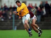 28 April 2001; Brendan Cummins of Tipperary is tackled by David Tierney of Galway during the Allianz GAA National Hurling League Division 1 Semi-Final match between Galway and Tipperary at Cusack Park in Ennis, Clare. Photo by Ray McManus/Sportsfile